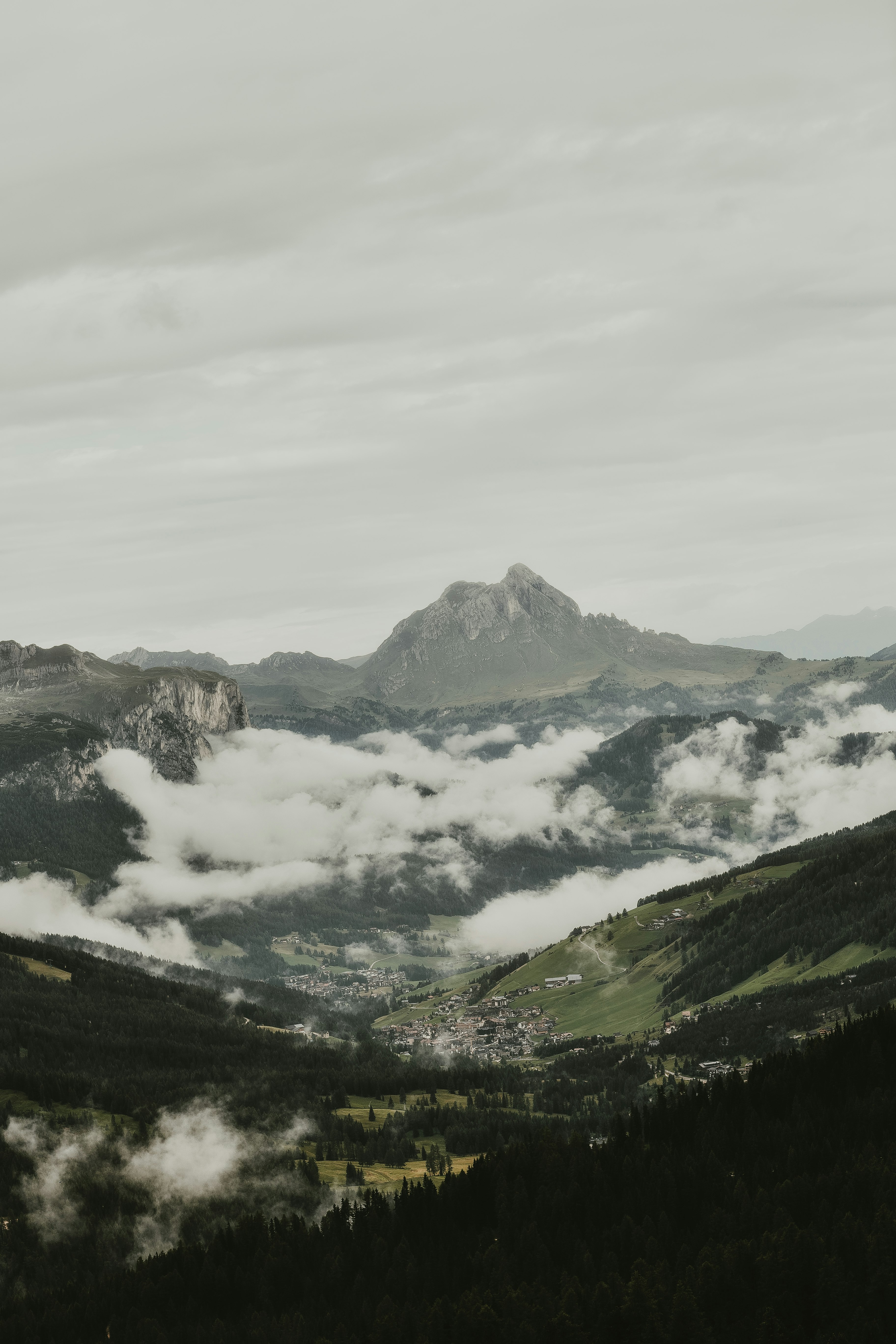 aerial photography of mountains surrounded by clouds